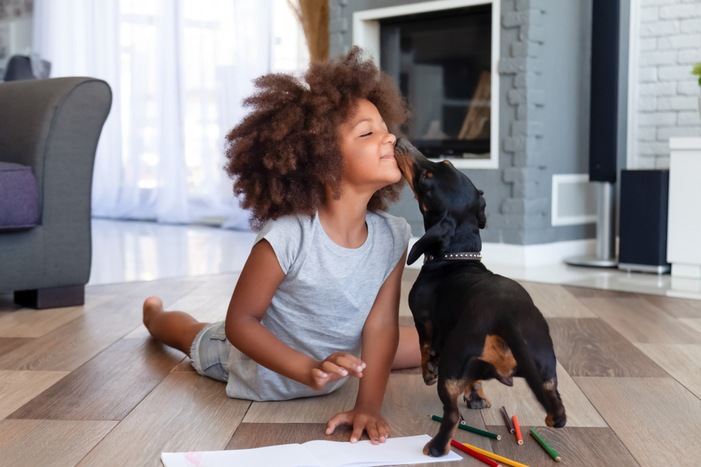 Funny,Little,African,American,Girl,Lying,On,Floor,Coloring,Picture